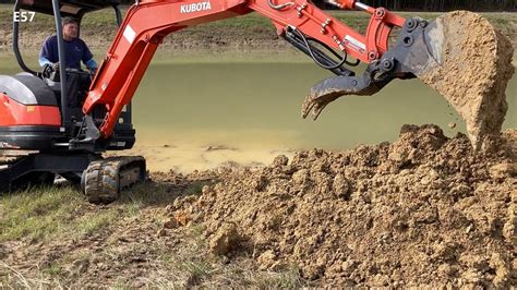 digging a pond with mini excavator|digging a small farm pond.